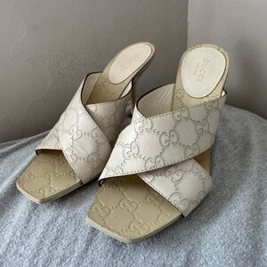 Gucci Ivory Crossband GG Embossed Leather Mules